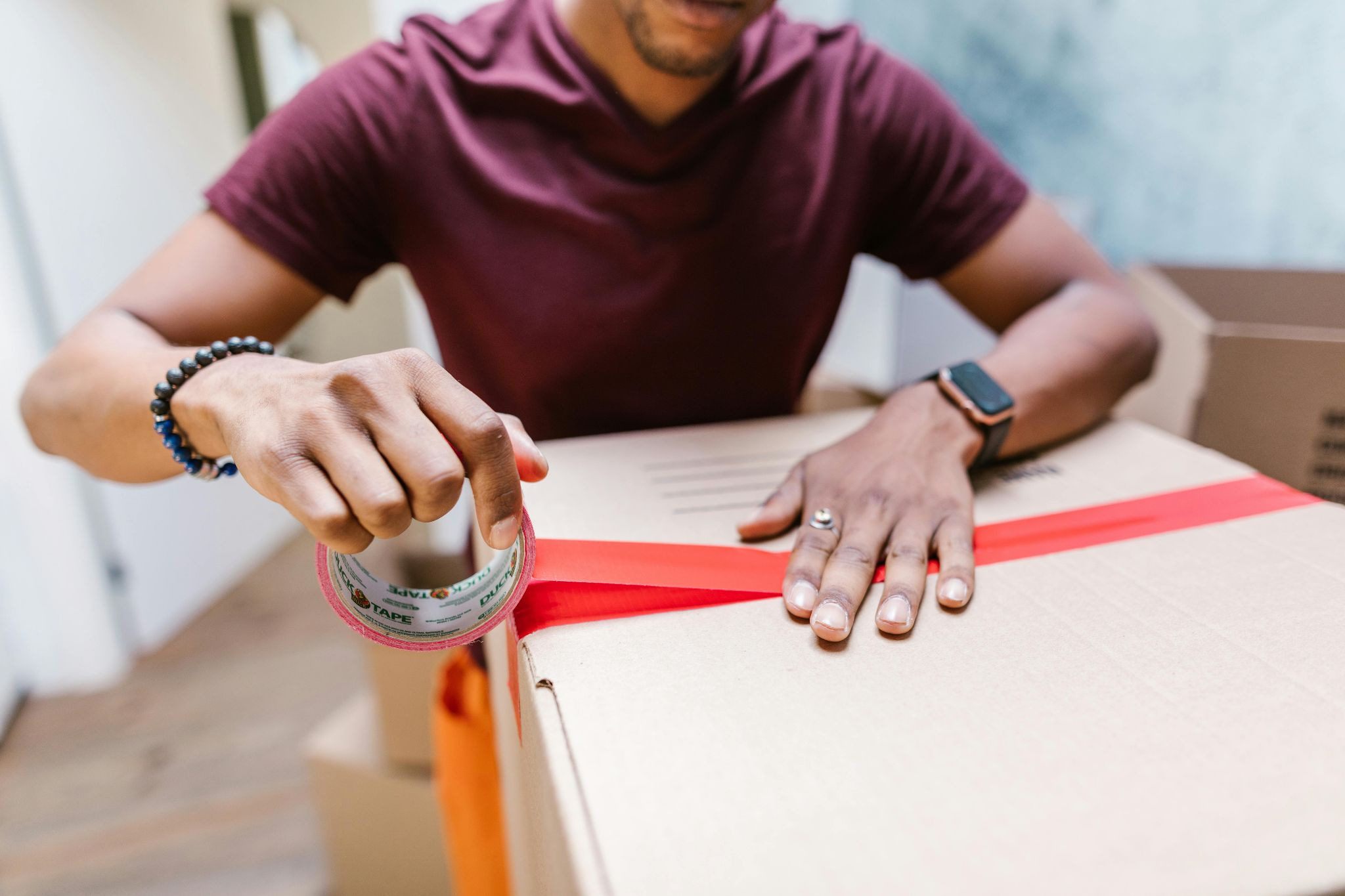 Person packing boxes to move out