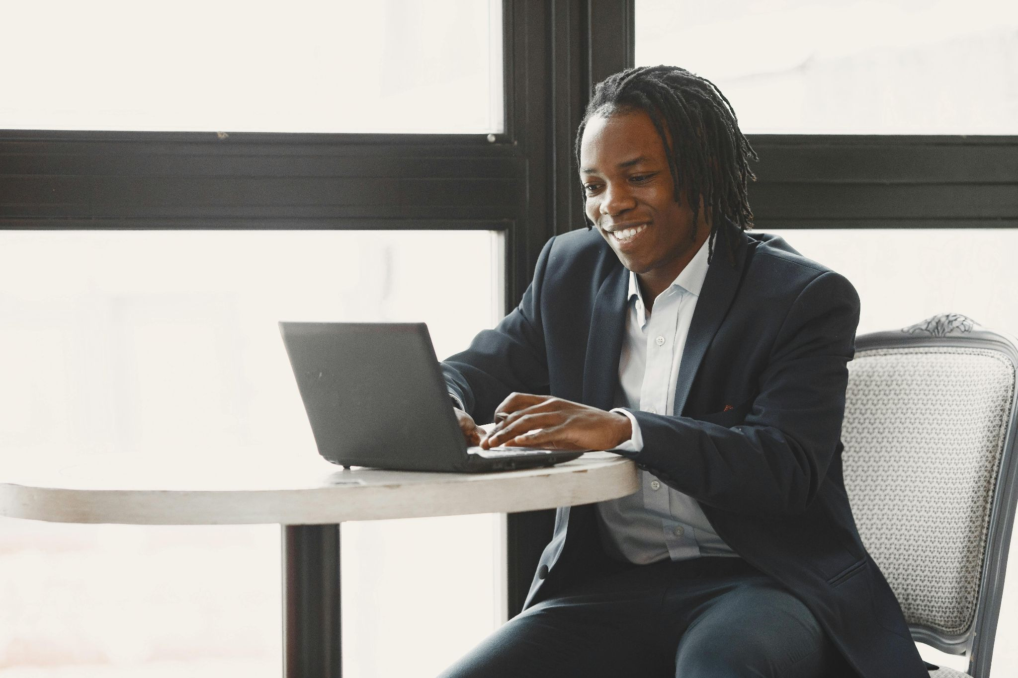 Happy landlord with laptop