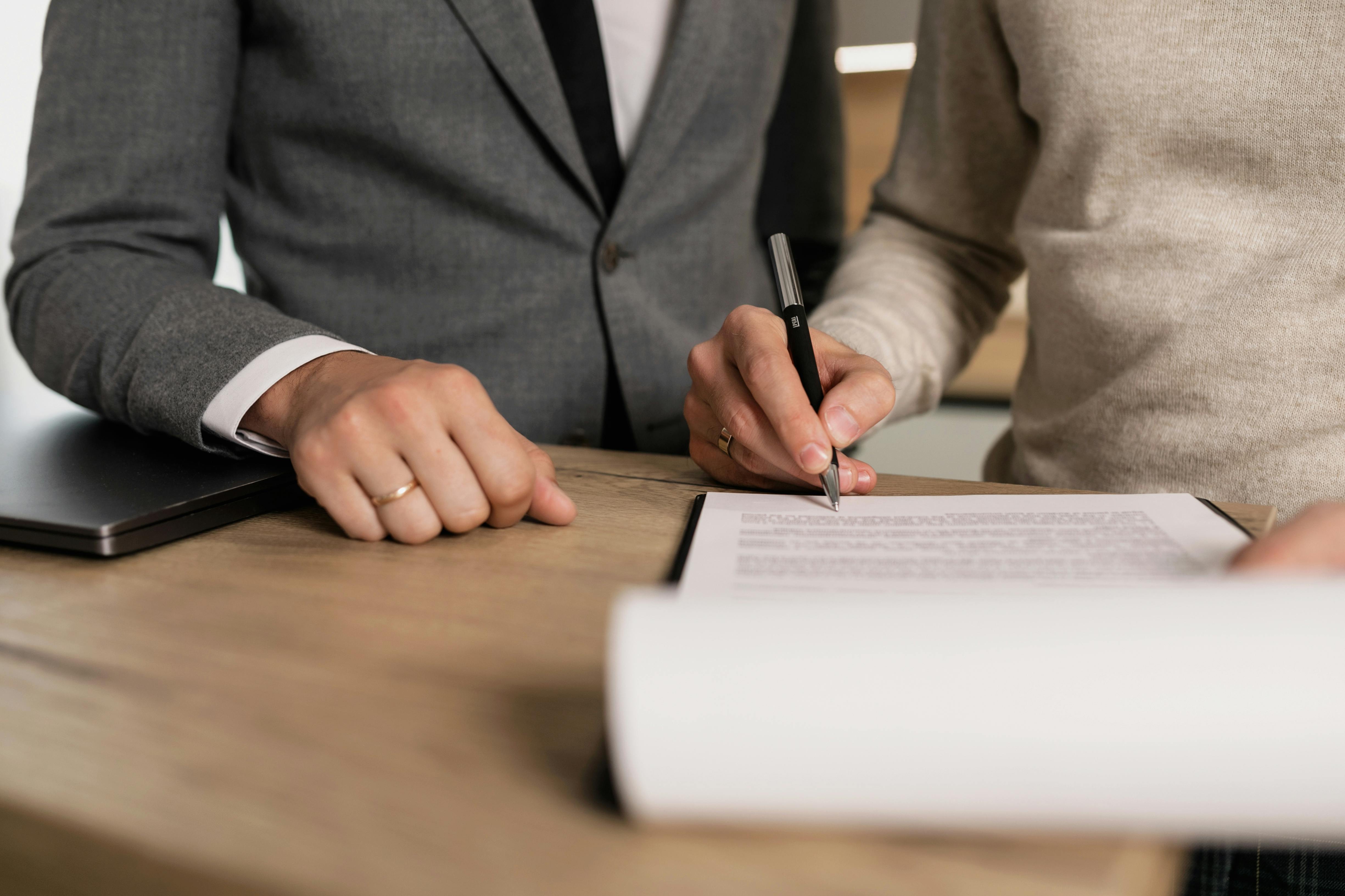 A San Diego landlord signs their property management agreement