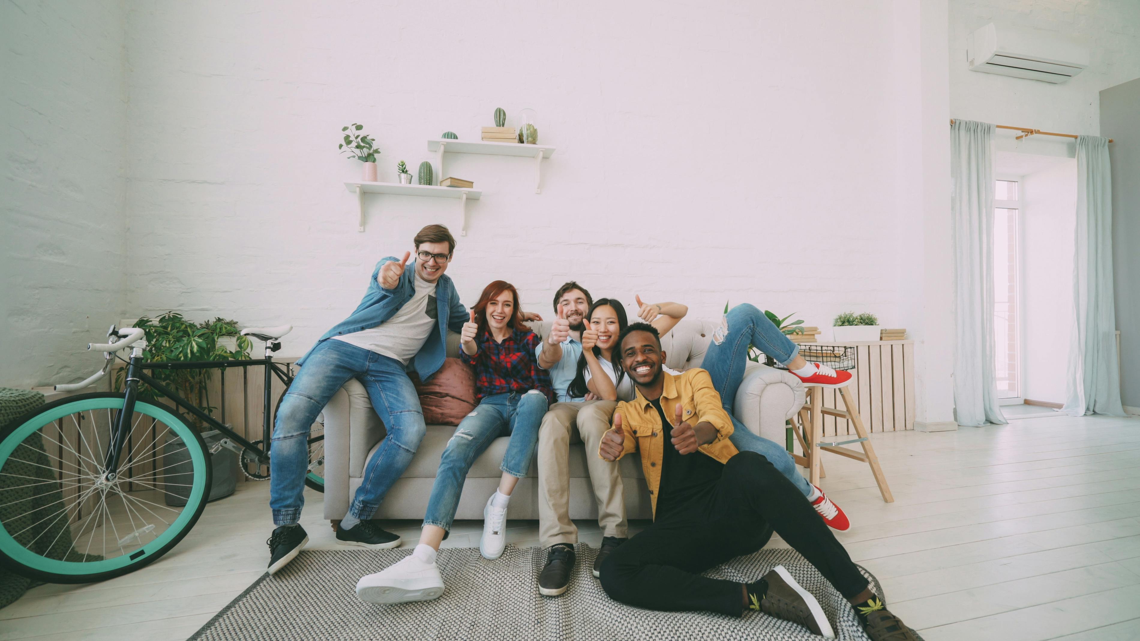 Diverse Happy Tenants on a Couch