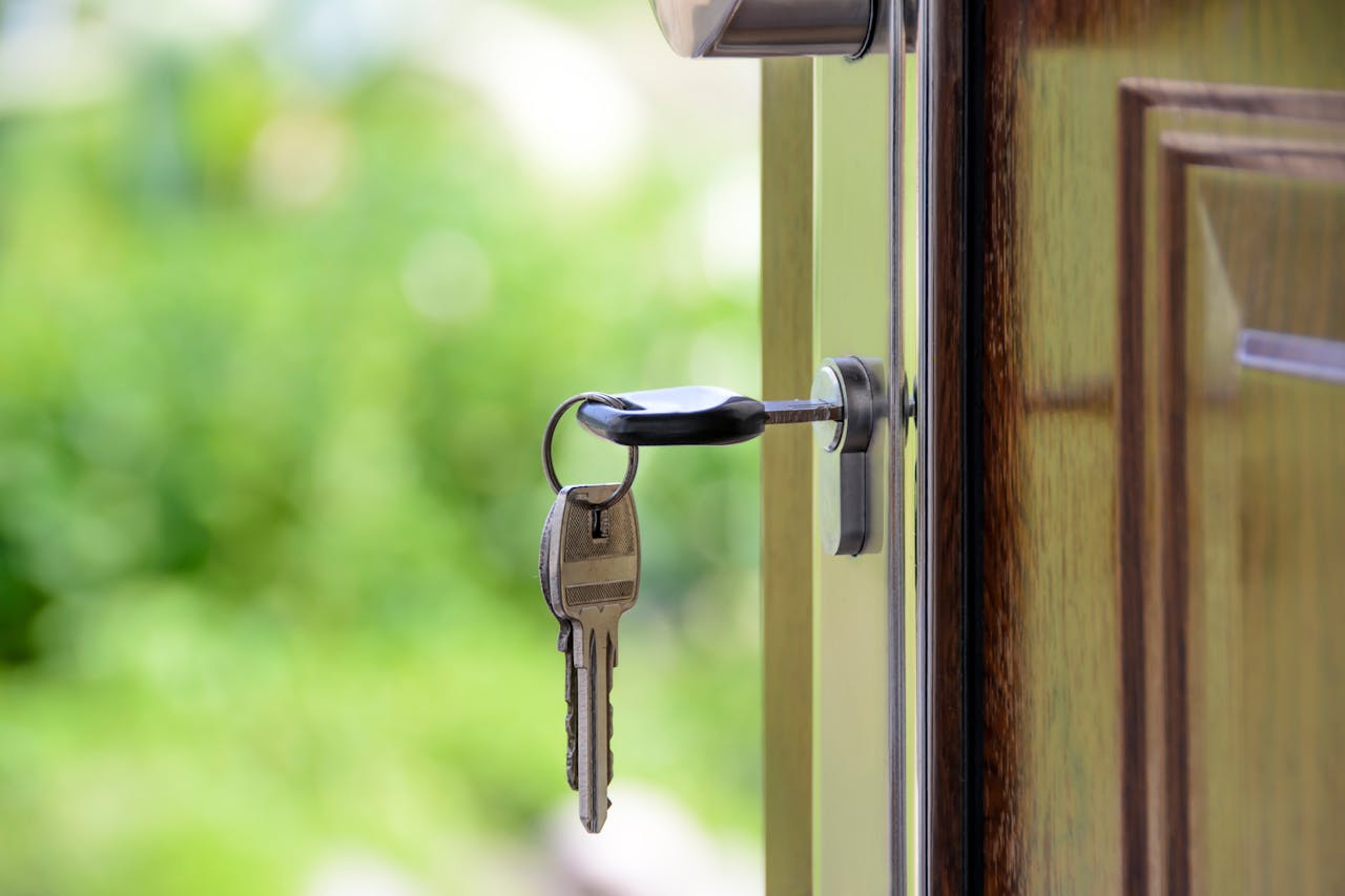 keys opening door to vacant property
