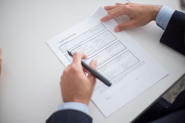 person reading an application